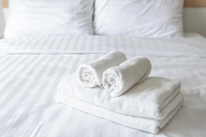 Munnar hotel white bedsheets